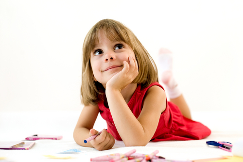 girl wondering and colouring